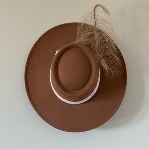 Brimmed felt hat with feather